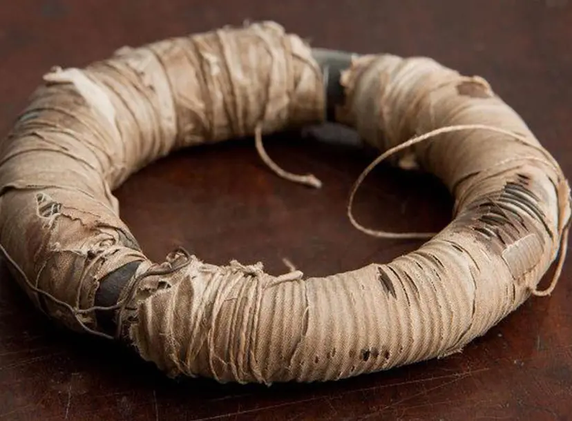 iron ring covered in copper wires and cotton cloth