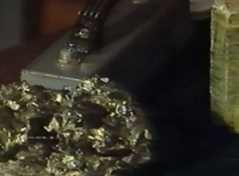 A jagged cystal, in front of a smooth crystal in the background