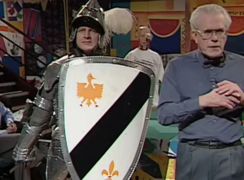 Charles Stirling standing next to a man dressed as a knight in armour