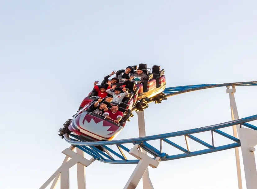 People riding a roller coaster 
