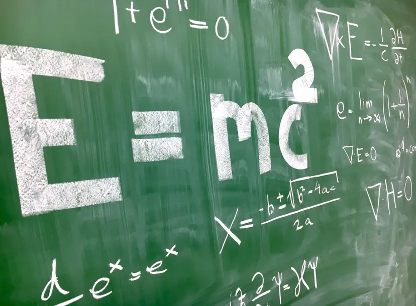 Maths equations on a chalkboard