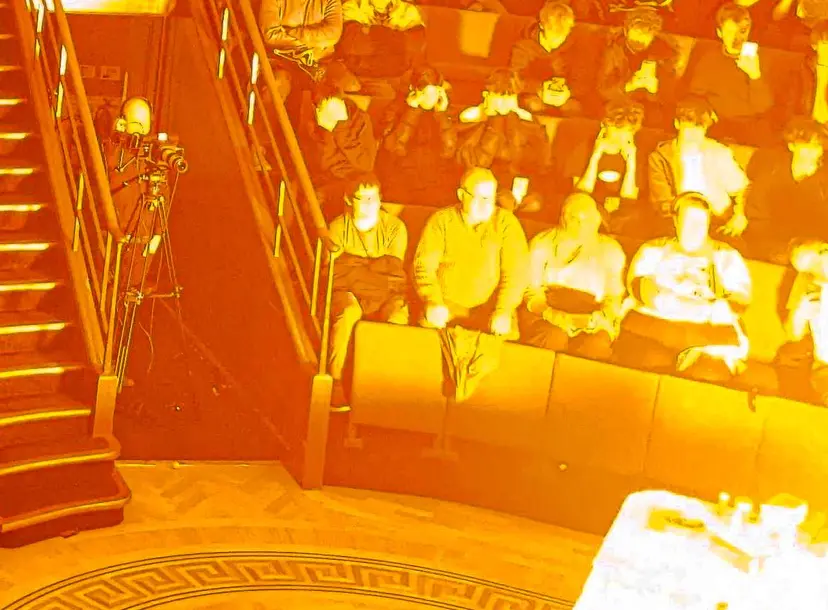 The Ri Theatre with a fire demonstration surrounded by the audience