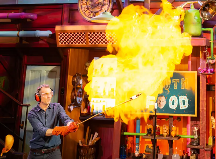 Chris van Tulleken igniting a balloon full of flammable gas