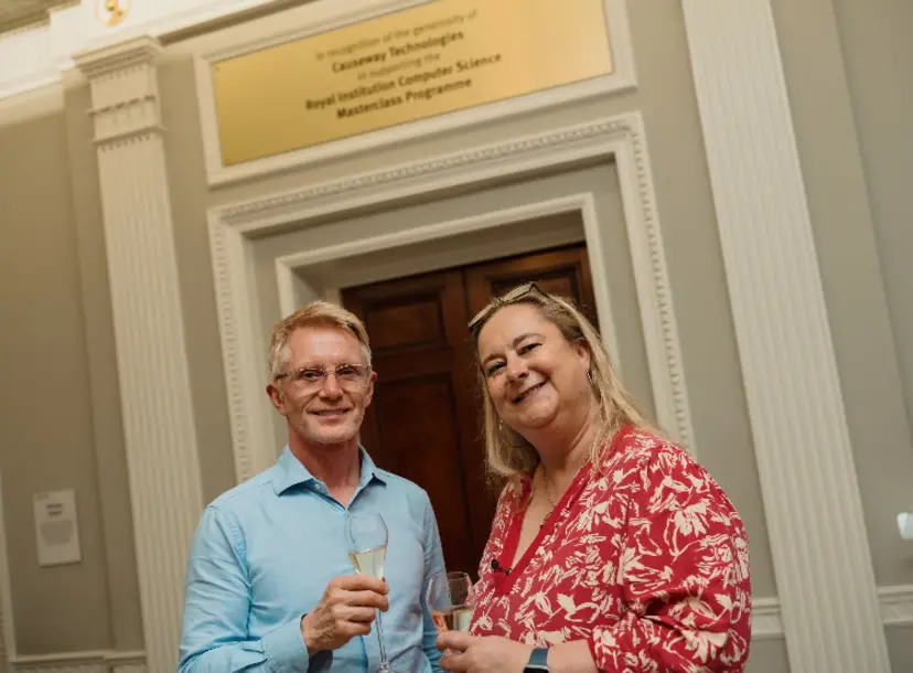 Phil Brown, Executive Chairman of Causeway Technologies and Katherine Mathieson, Director of the Royal Institution, in front of the Causeway plaque in the Ri