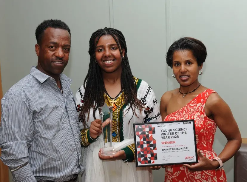 Hasset Kifle and her parents celebrate her award