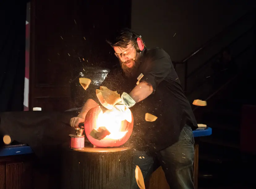 Presenter is exploding a pumpkin