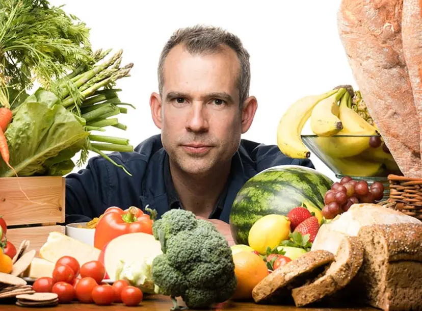 chris is surrounded by food items