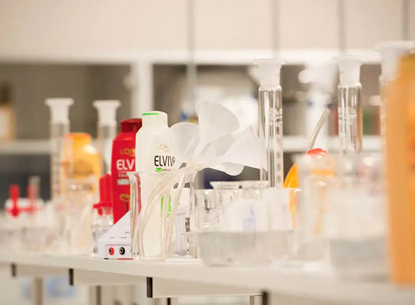 shampoo bottles and scientific beakers and tubes