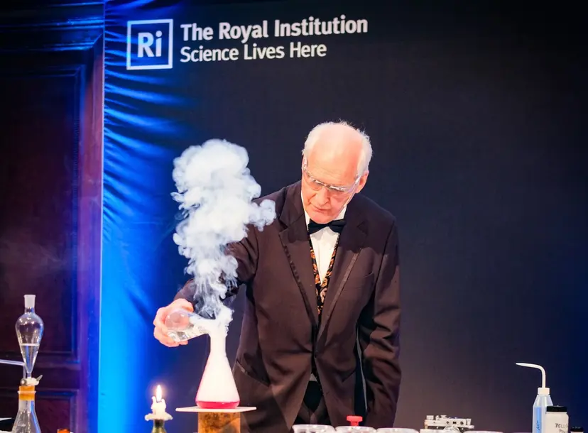 Image of Andrew at the Ri with a plume of smoke coming out of a conical flask in front of him