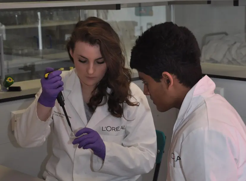 Two students using a micropipette