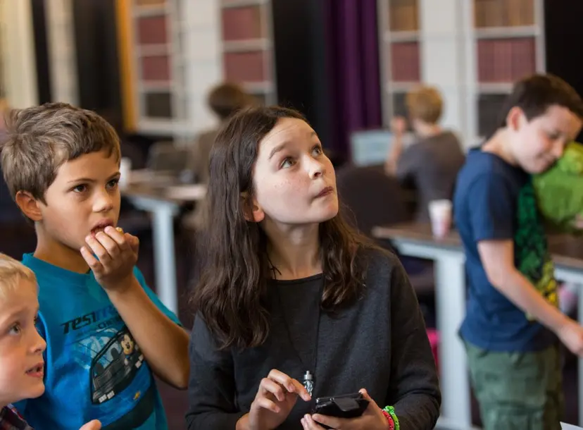 Students stunned looking at a science demonstration