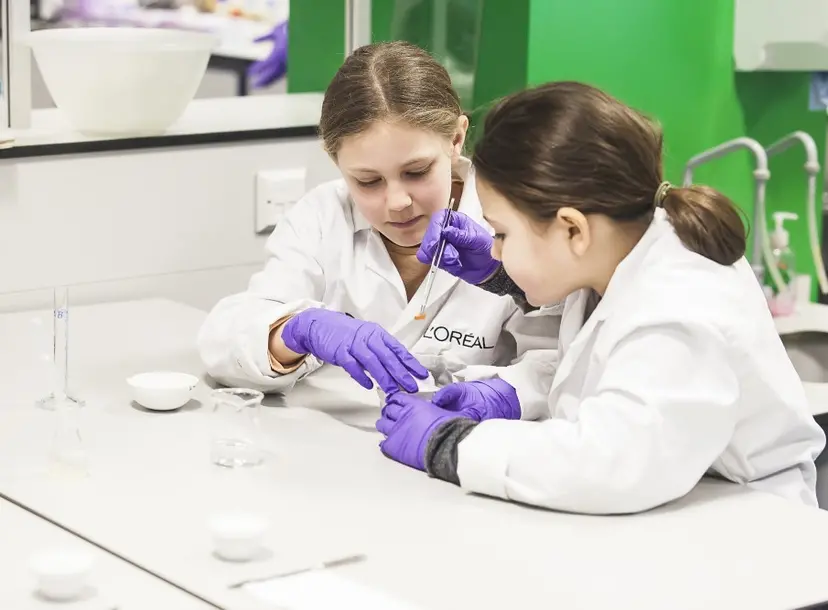 Two students experimenting with pH paper