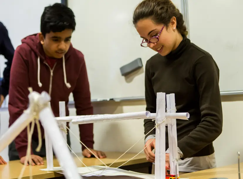 Two participants building a structure