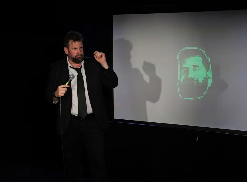 Garrett Millerick with his AI clone on a screen