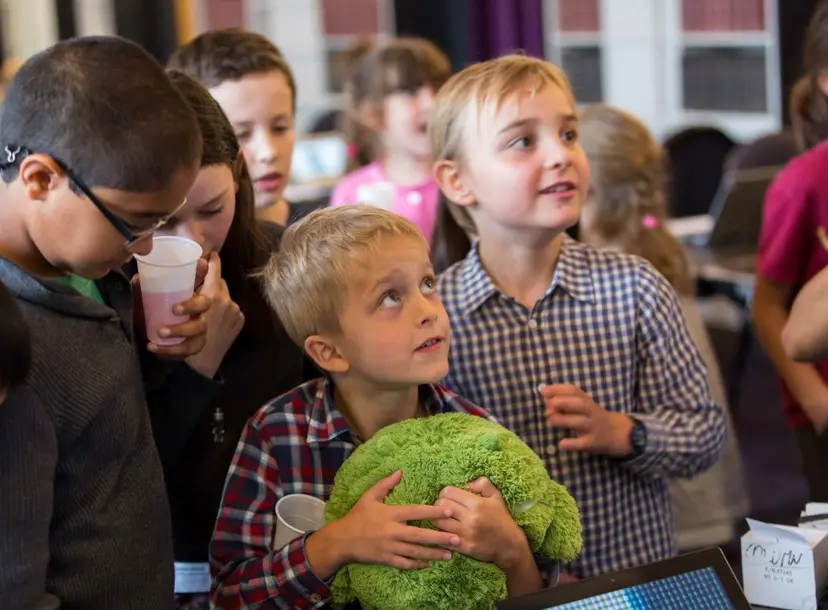 Students stunned looking at a science demonstration