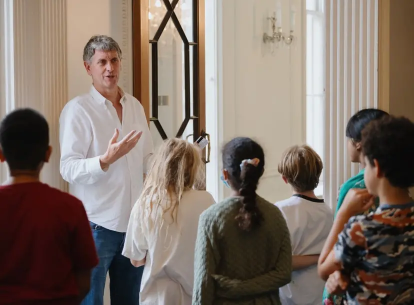 A teacher and students standing