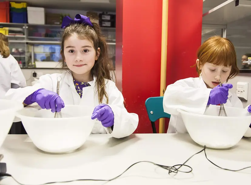 Two participants making bath bombs in the lab