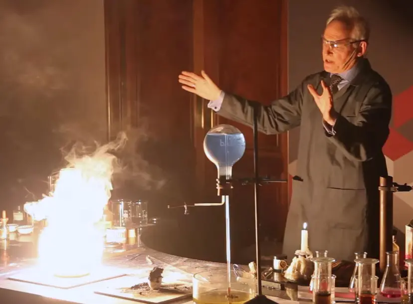 Andrew Szydlo with a desk full of exciting flames