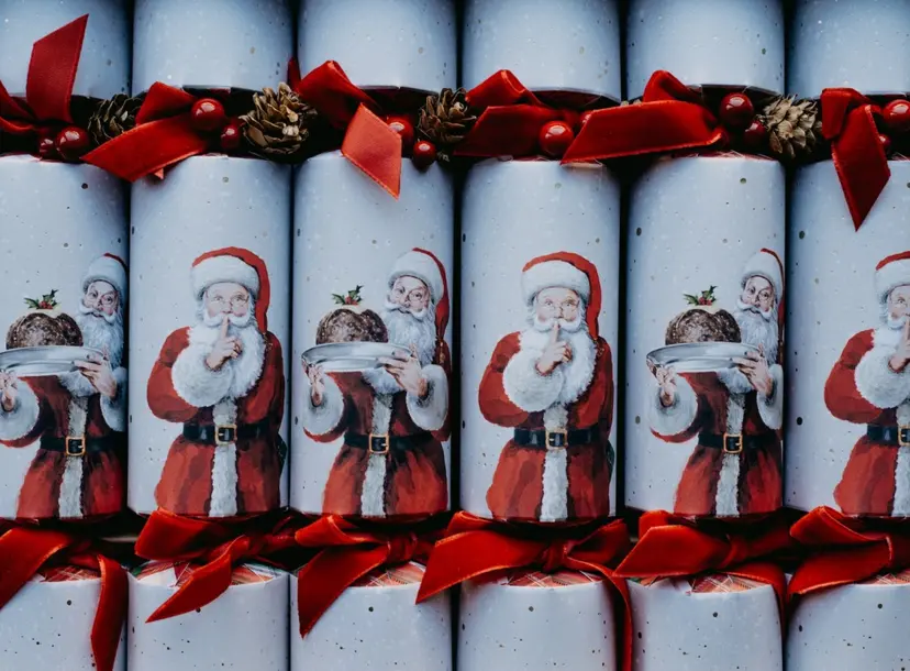 White christmas crackers with an image of Santa on each one