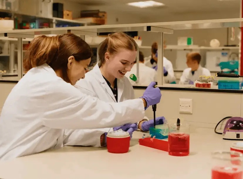 Two students using a micropipette 