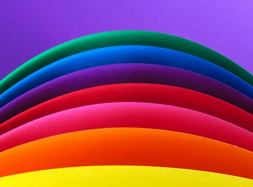 layers of colour - yellow, orange, pink, red, purple, blue, dark green, all on a light purple background
