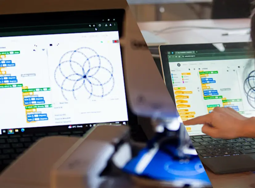 Child points a to a computer displaying some lines of code