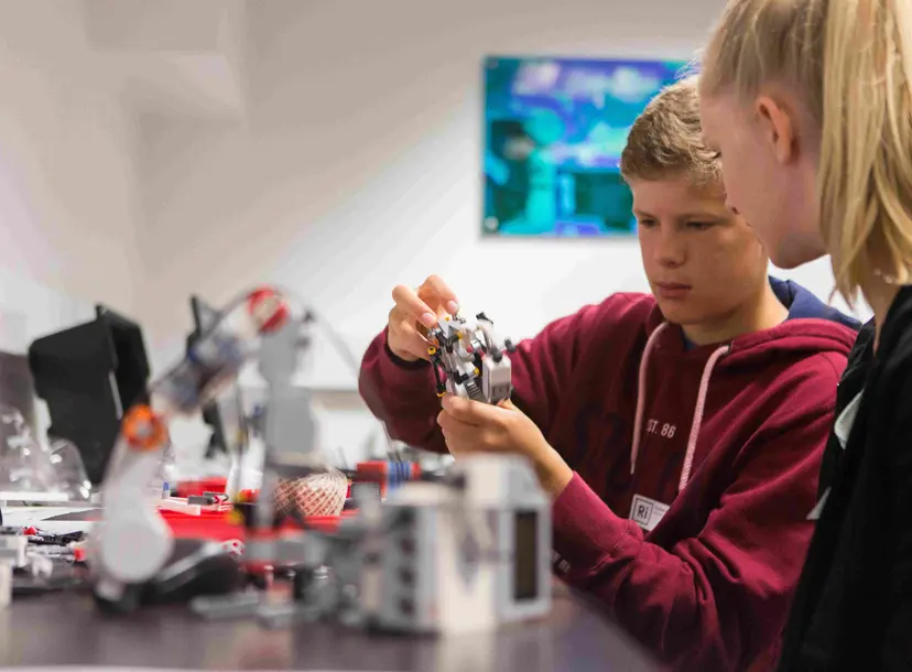 Participants working on a robotics project at a workshop