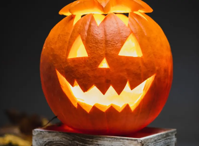 A pumpkin with a scary face covered out