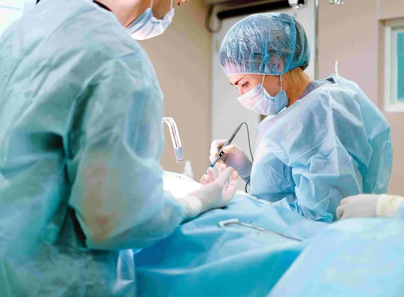 A surgeon performs surgery
