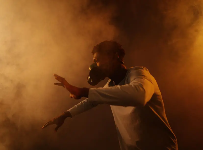 A man wears a mask in smog