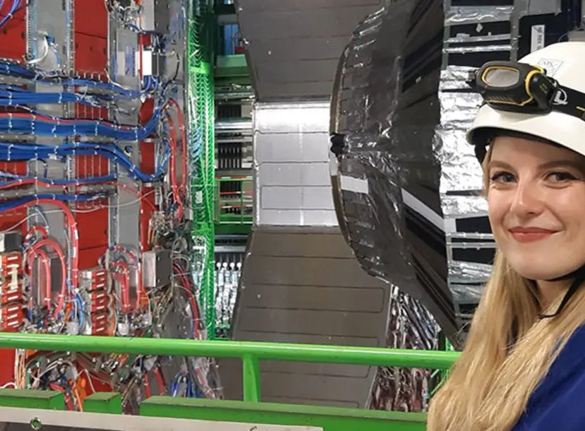 Kathryn in front of the CMS detector during training to become a tour guide