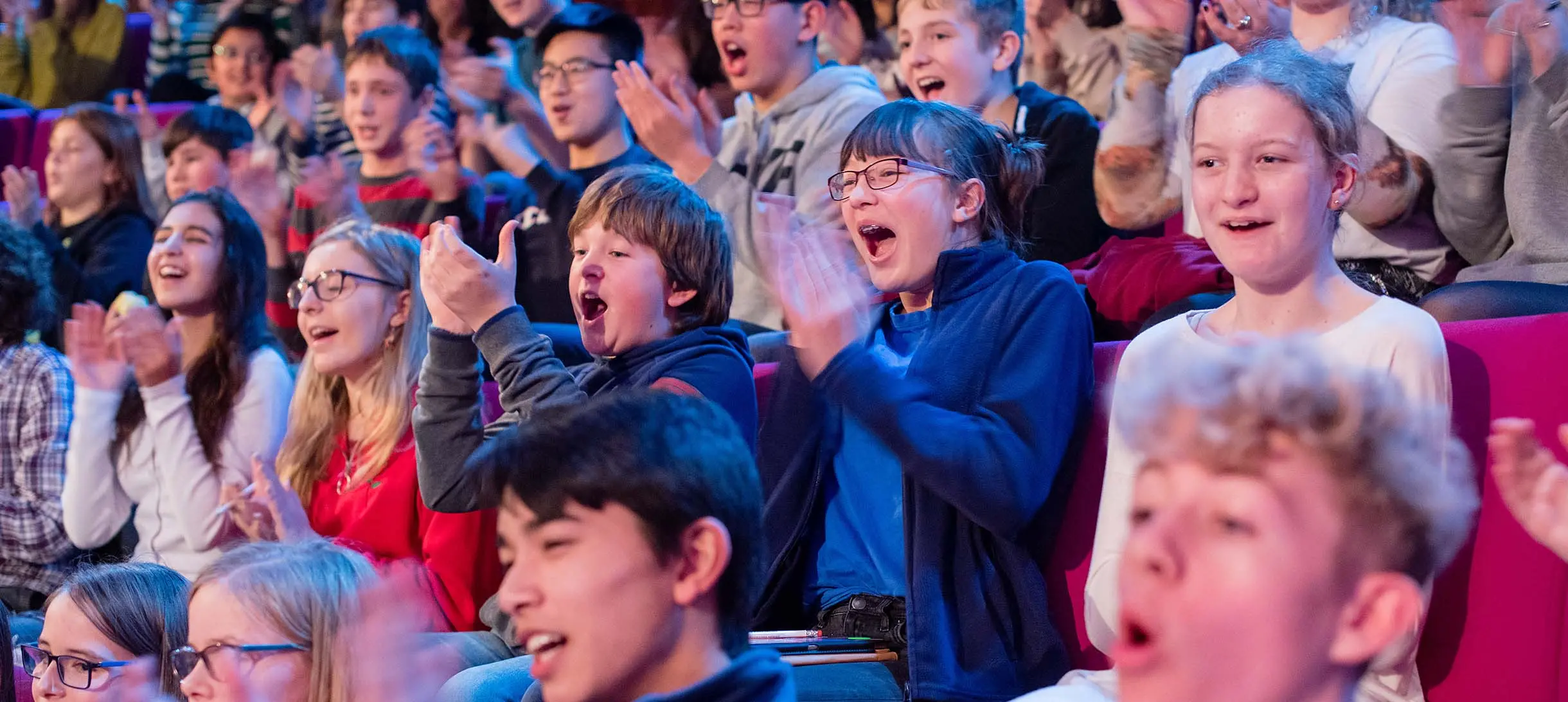 Christmas Lectures audience whooping and clapping at something off camera