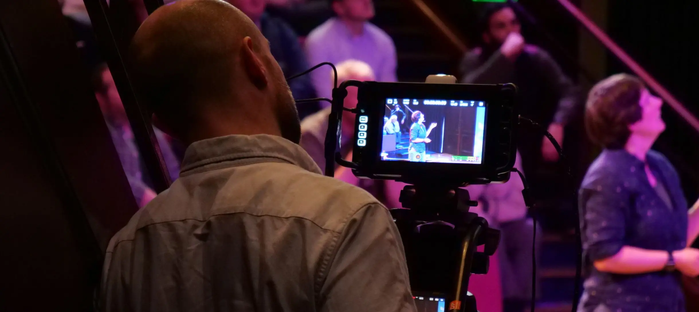 A man filming an event