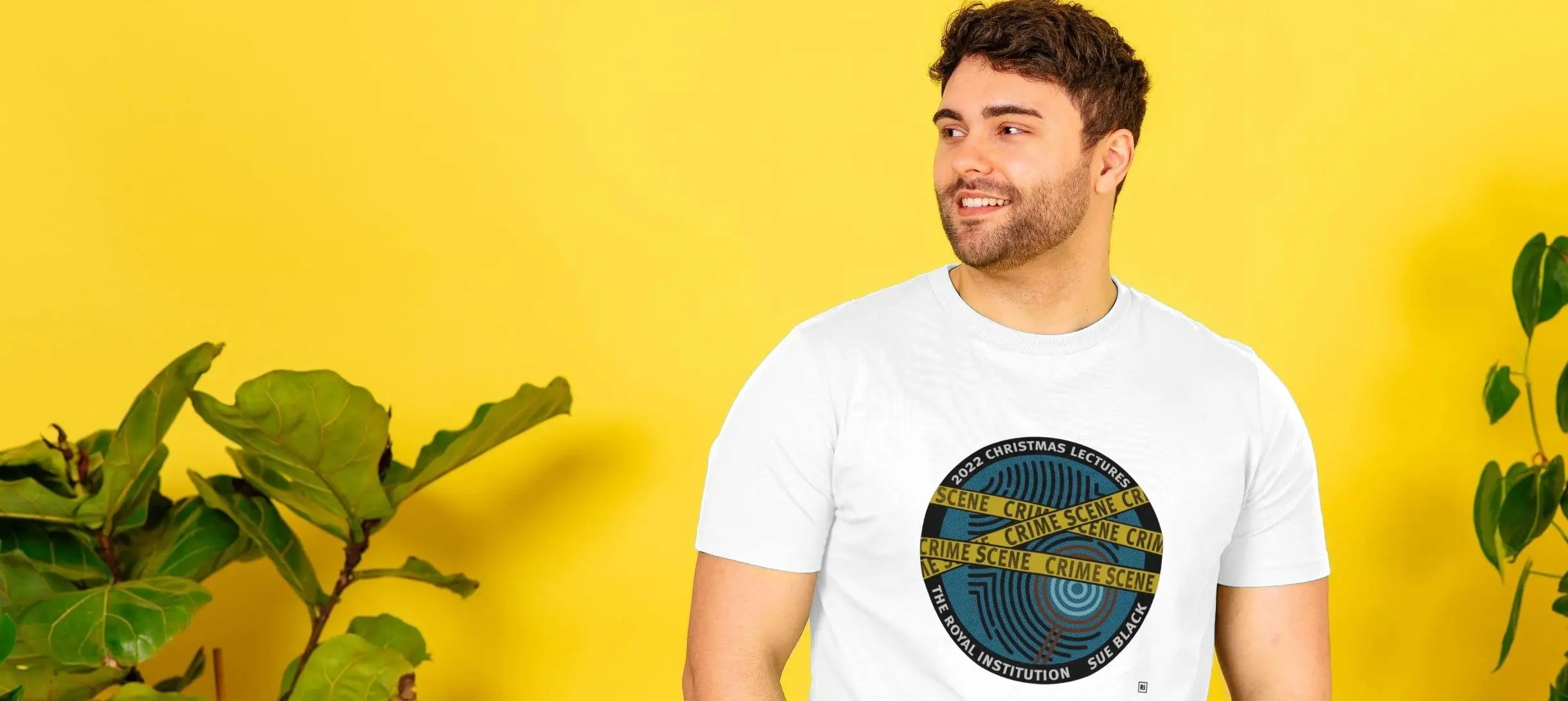 A white man wearing a t-shirt with a CHRISTMAS LECTURES 2022 design.