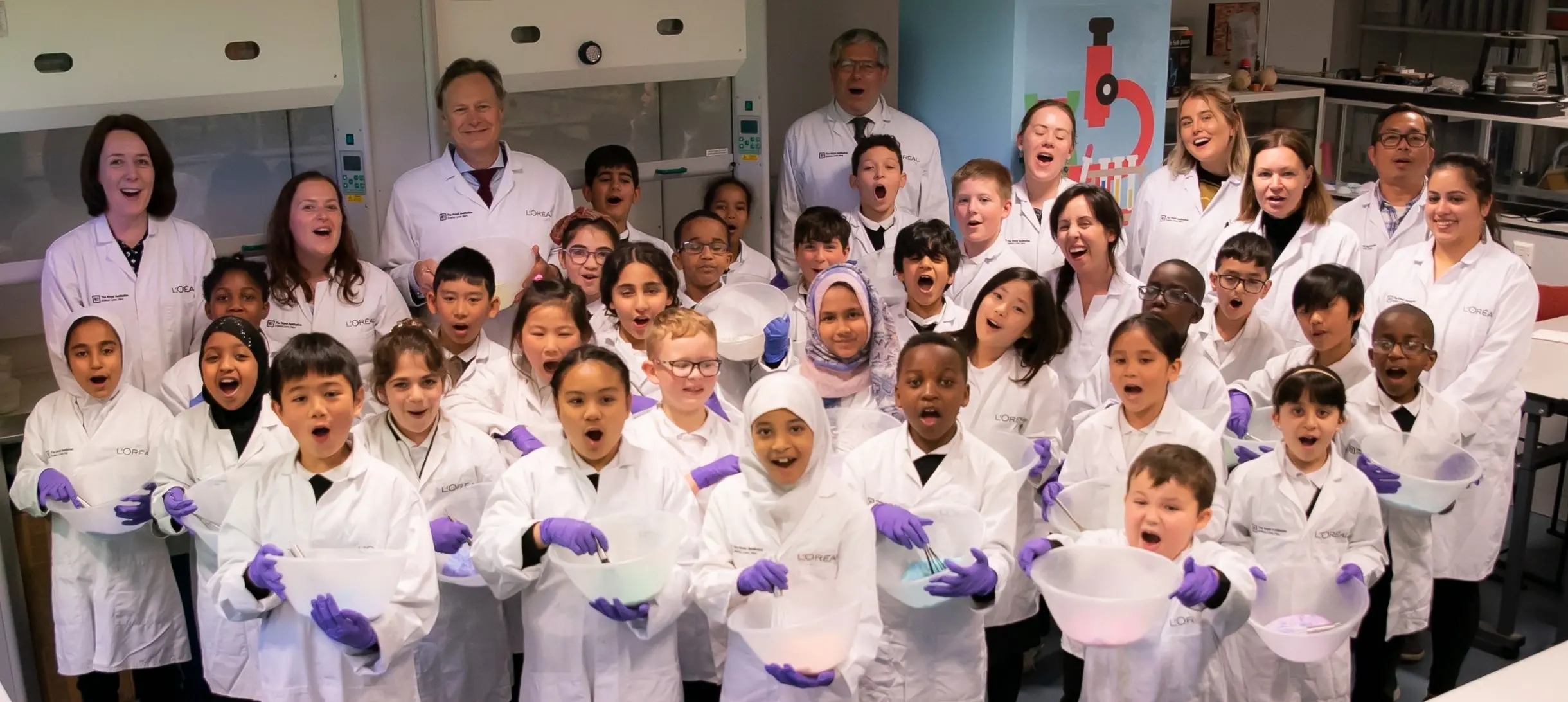 Children in lab coats in the Young Scientist Centre