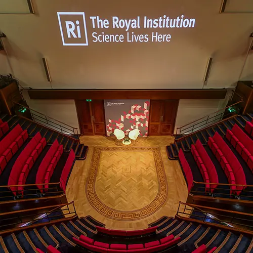 top down view of the stage and chairs of the Ri lecture theatre