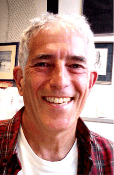 A similing white man with short grey hair
