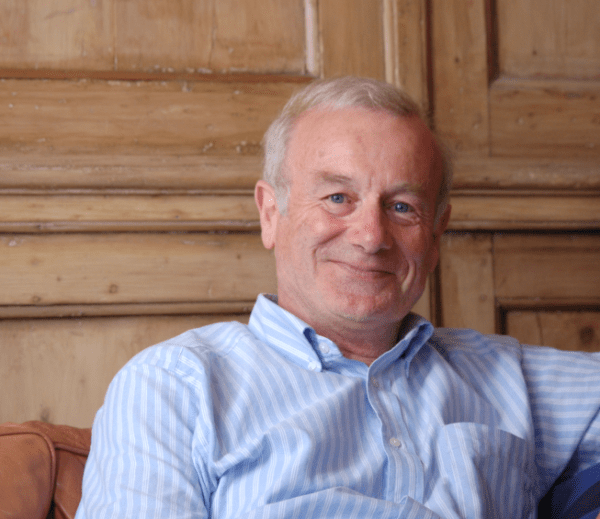 A profile picture of a man in a pale blue shirt. It is Frank Close.