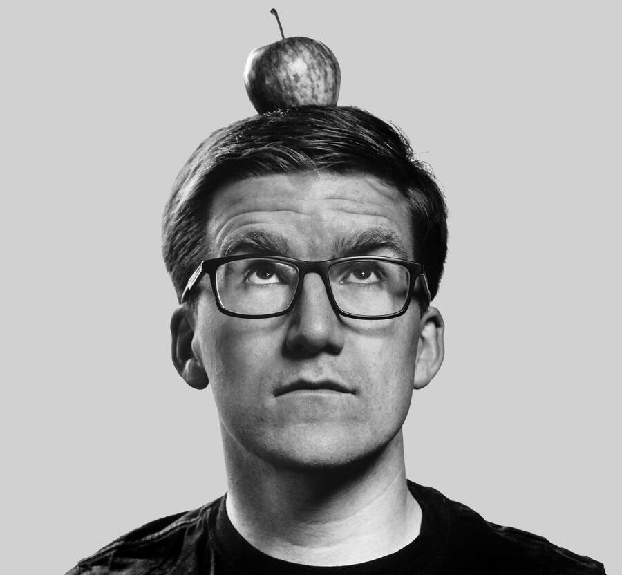 Kyle Evans with an apple on his head.