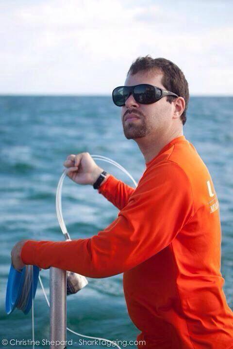 A man on a boat, with dark goggles on