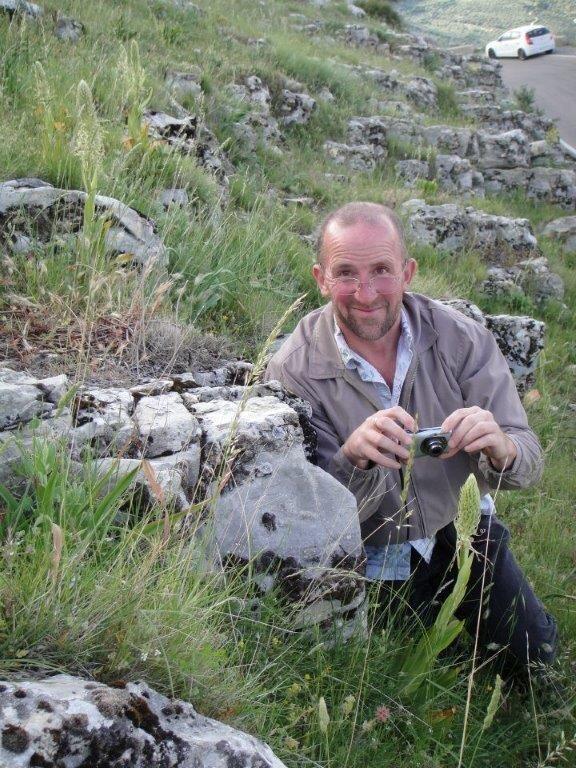 Michael Fay with a lizard orchid.