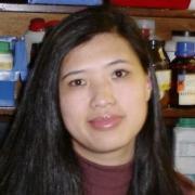 A woman is facing the screen. She has long black hair.