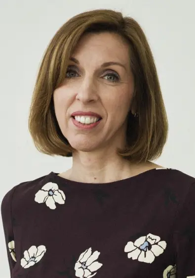 a woman is looking at the camera
