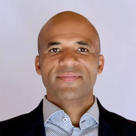 A man is smiling at the camera.