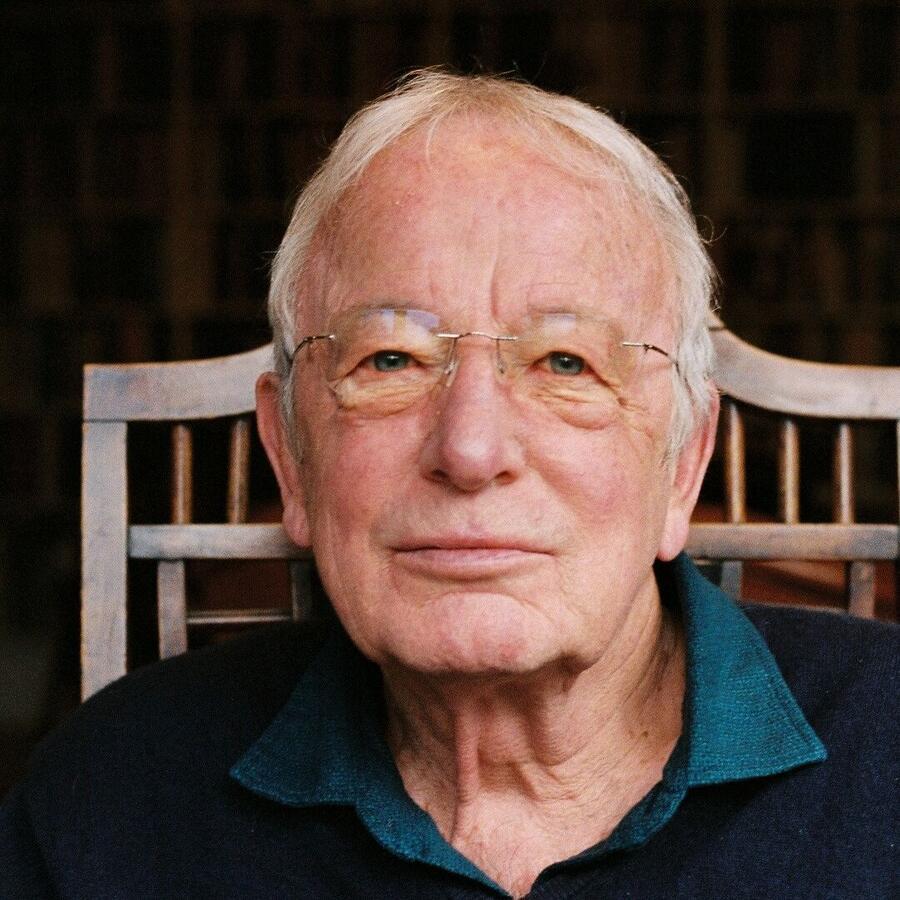 A man is looking towards the camera