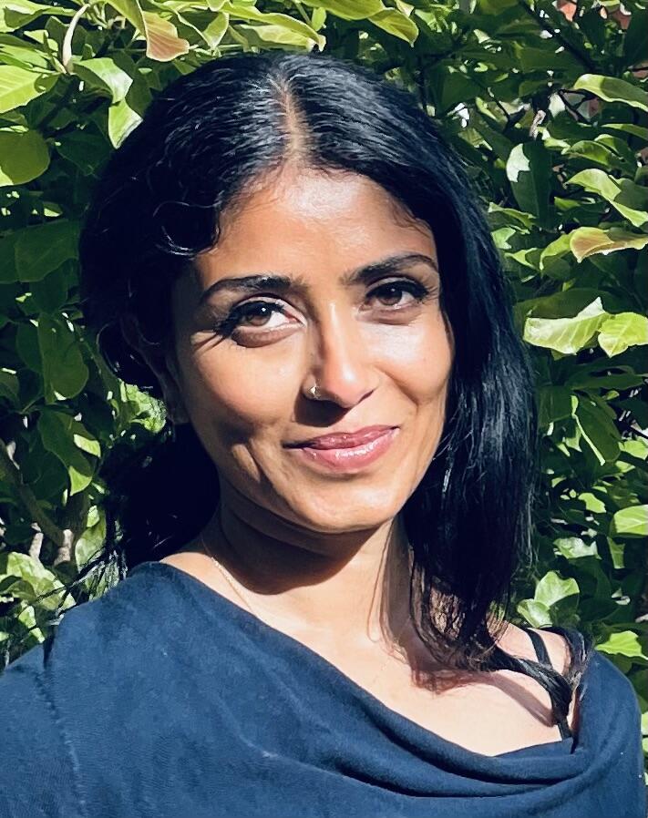A woman is smiling