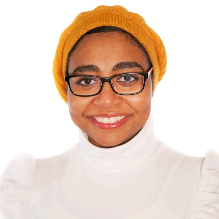 A woman is smiling