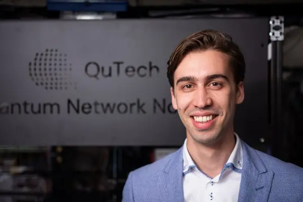 A man is smiling at the camera