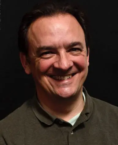 A man is smiling at the camera.