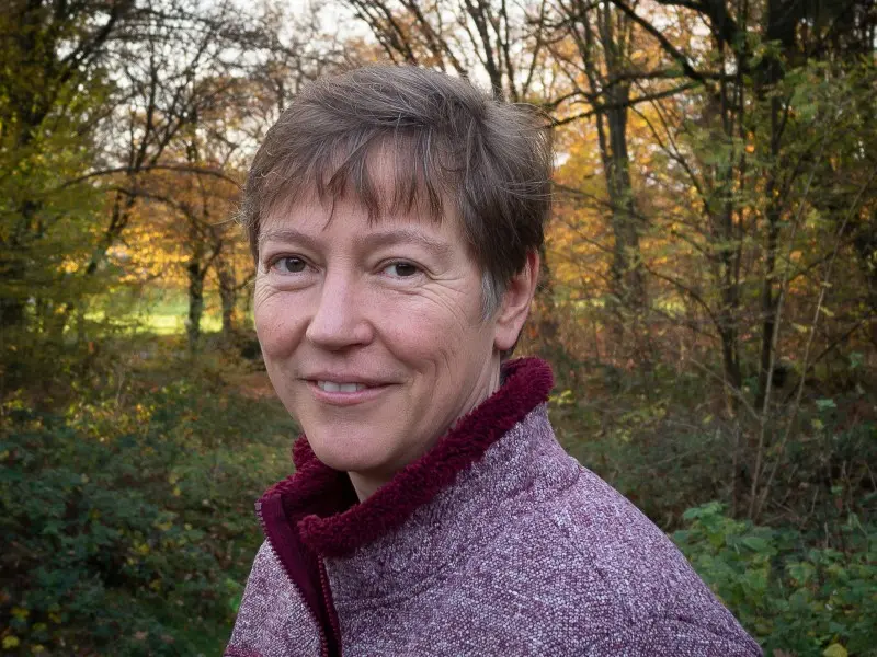 A woman is smiling at the camera